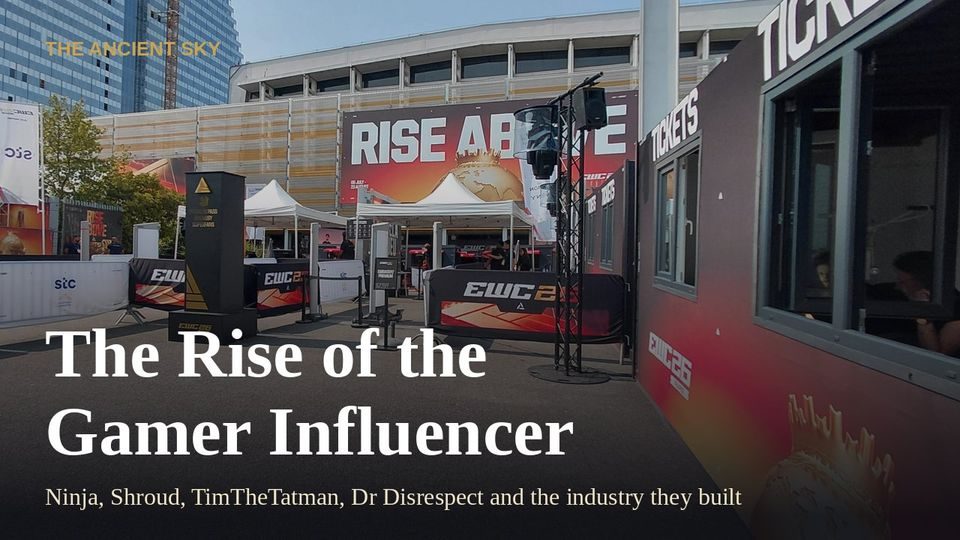 The Ancient Sky: The rise of the gamer influencer. The entrance gate of the 2026 Esports World Cup in Paris, with ticket booths, banners and a tall black sign.